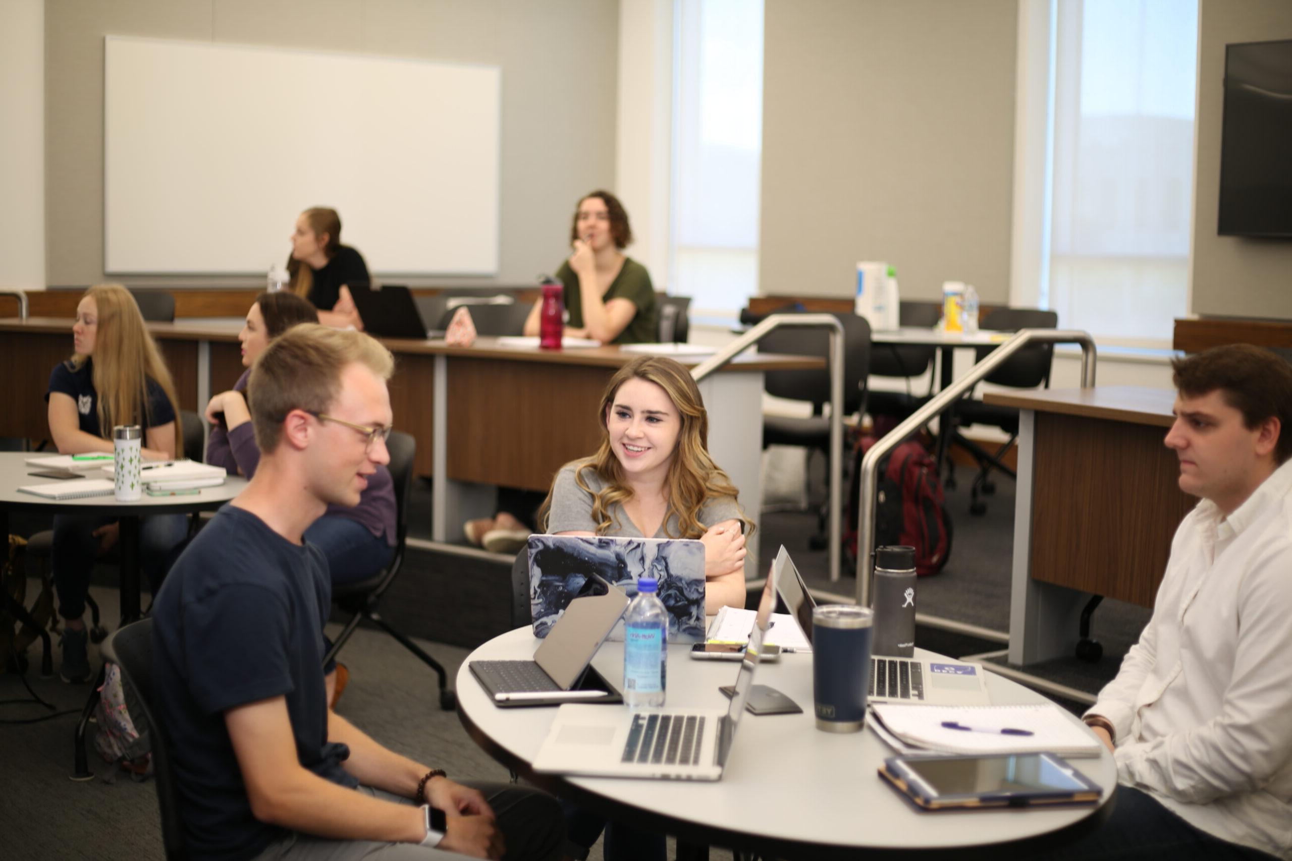 Male and female Butler students in a business class.